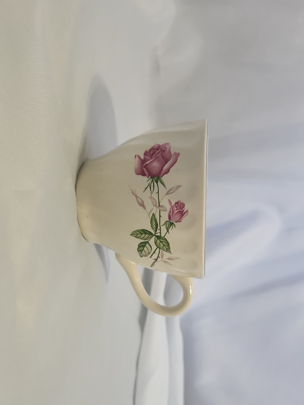 Source Unknown Cream Porcelain Teacup with Pink Rose Motif